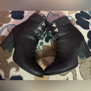 Used mid size black booties , size 9.